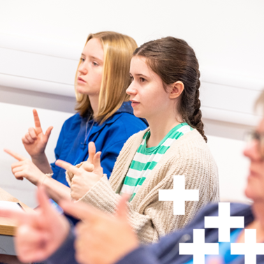 photo of british sign language students practicing in class