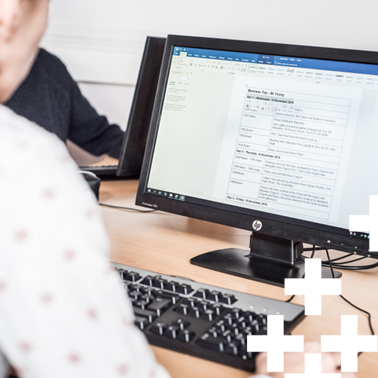 Over the shoulder photo of a business student working on a document