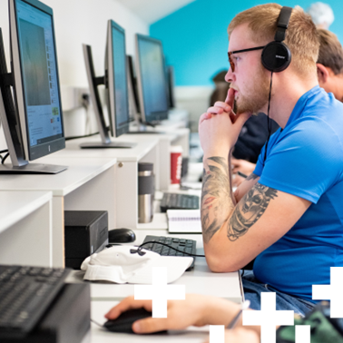 Photo of a computing student looking at a screen