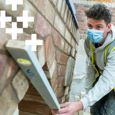 photo of brickwork student working on a wall