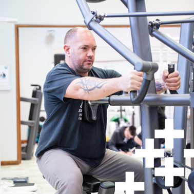 photo of sports student working on equipment